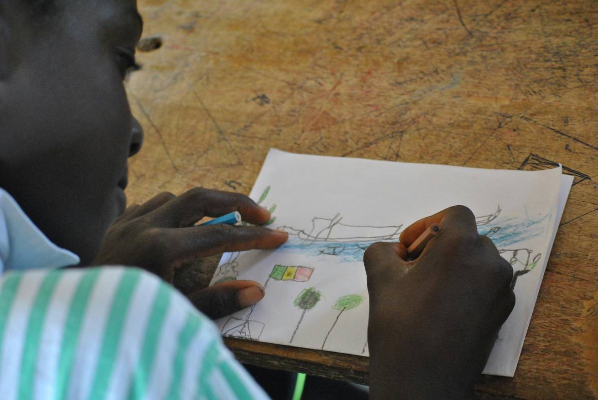 Child sketching outdoors showing drawing benefits for children through nature observation