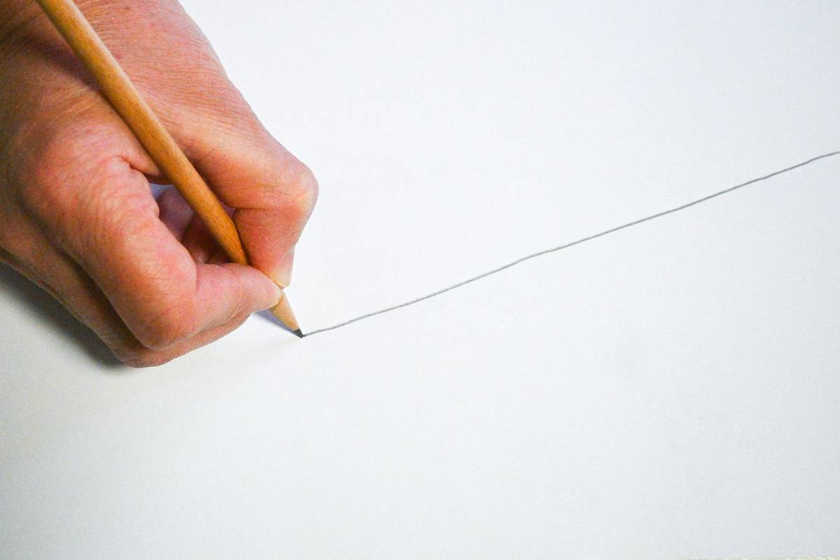 simple sketch drawing for beginners tools laid out on white desk